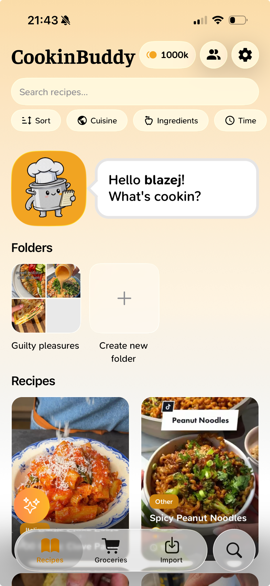 Recipes saved from links and photos, filed into folders on the CookinBuddy home screen
